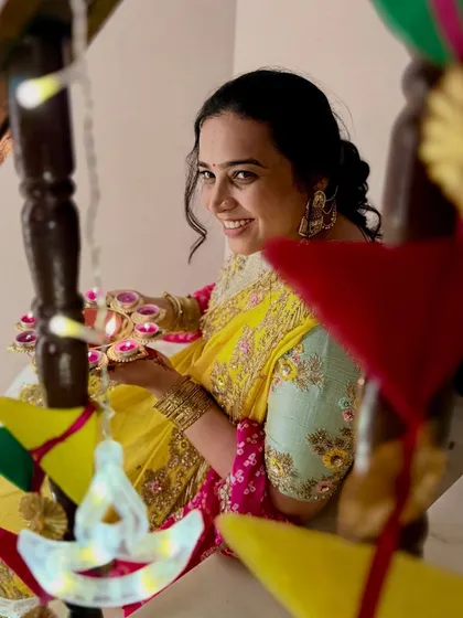 A close-up shot of me with diyas during Diwali. This beautiful, traditional photo captures the essence of the festival of lights and showcases my ability to create aesthetic, culturally relevant content.