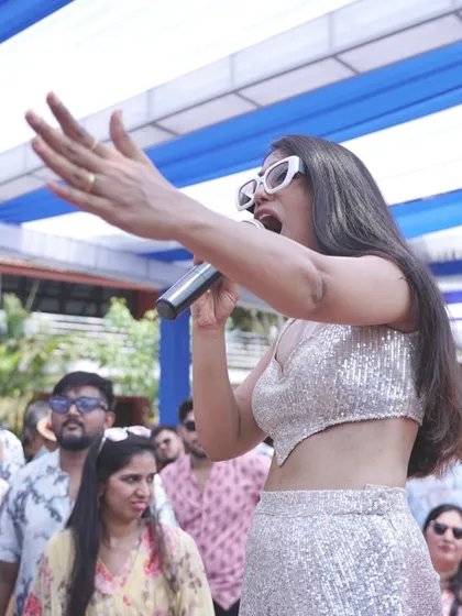 Getting the crowd hyped up at a Goa pool party. My job is to make sure your guests are entertained and the party atmosphere is electric from start to finish.