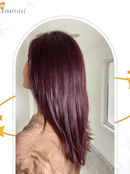 A side view of the red shine glam look, showcasing the sleek finish and rich, consistent color from root to tip.