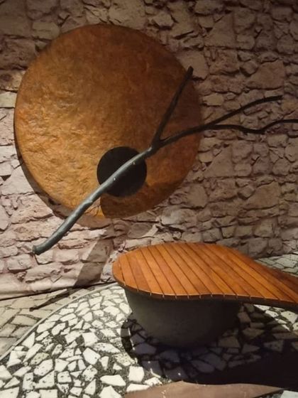 A close-up of the custom flooring and a unique wall art piece, showing how we combine different materials and textures.