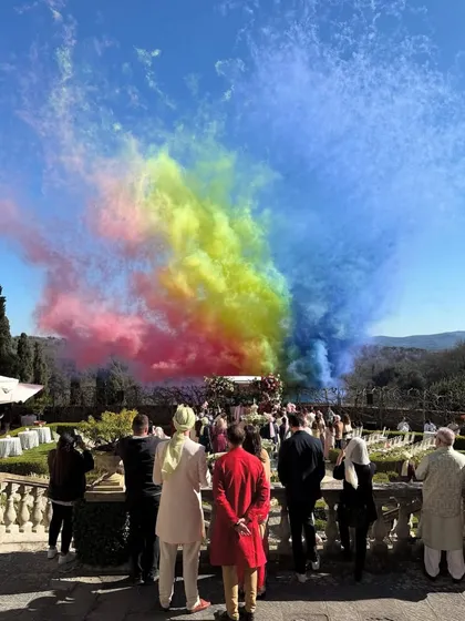 A massive rainbow smoke display during the wedding ceremony in Tuscany. This is the kind of epic, unforgettable moment we help create.
