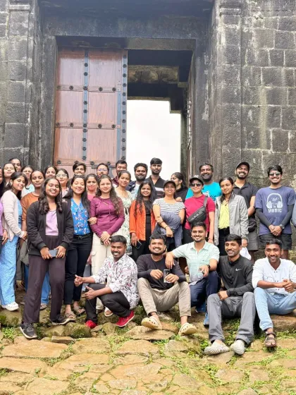 A full group shot in front of a historic stone gate, a common feature in the forts we sometimes explore on our treks.