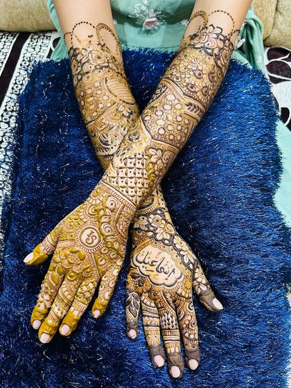 The back of the hands for a full bridal look, featuring personalized initials and the groom's name.