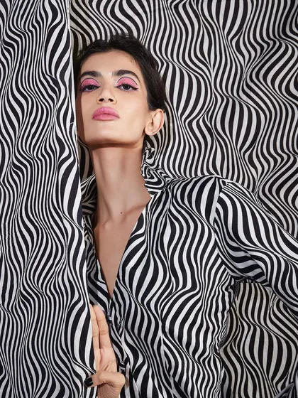 A fun and creative portfolio shoot where patterns clash and a pop of pink makes monochrome exciting. This shows our students' ability to work with bold concepts.