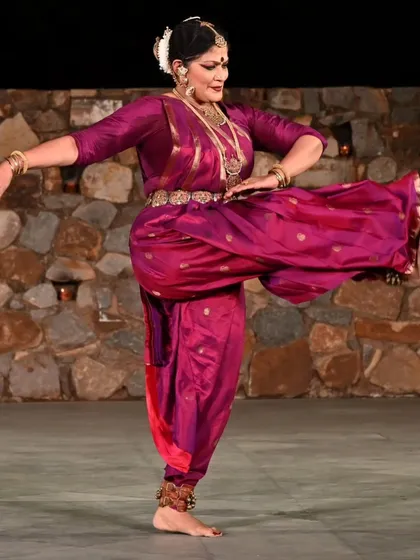 Performing at a heritage site like the Sunder Nagar Nursery amphitheater connects the dance to its roots in a special way. This pose captures the yoga-shakti, the inherent power and grace that is at the core of every Bharatanatyam movement. The costume and temple jewelry complete the visual poetry.