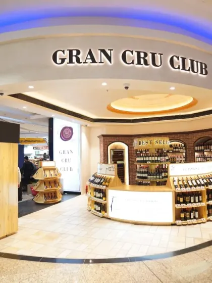 The storefront of the Gran Cru Club at Mumbai Airport. Our exterior commercial photography ensures that the entrance and branding are presented in a clean, inviting manner to attract footfall.