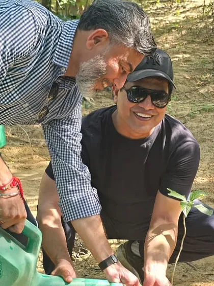 Restoration is a hands-on, collaborative effort. Here, volunteers from our corporate partner programs work together, carefully watering a newly planted native sapling at the Ghata Bundh site. These moments of connection are what fuel our mission.