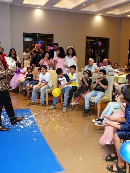 Another view of a captivated audience at a private party. My goal is to ensure that every single guest, from the front row to the back, feels included in the magic.