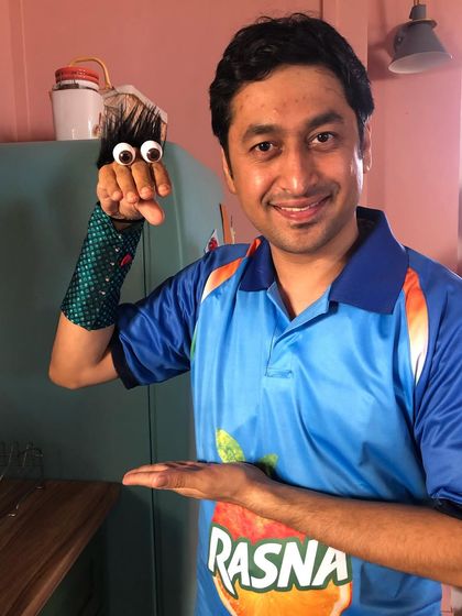 Demonstrating a simple hand puppet on the set of the Rasna commercial. Sometimes the simplest puppets can be the most effective for storytelling.