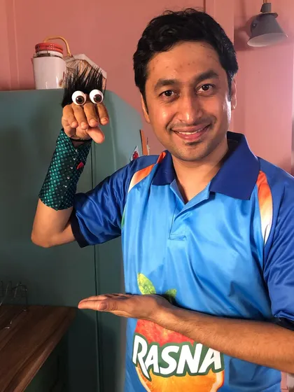 Demonstrating a simple hand puppet on the set of the Rasna commercial. Sometimes the simplest puppets can be the most effective for storytelling.