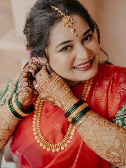 Radiant beauty for a radiant day. This bride is getting ready, and her makeup is designed to enhance her features and give her that unmistakable bridal glow.