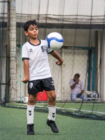 This player practices ball juggling, an excellent way to improve touch, balance, and overall comfort with the ball.
