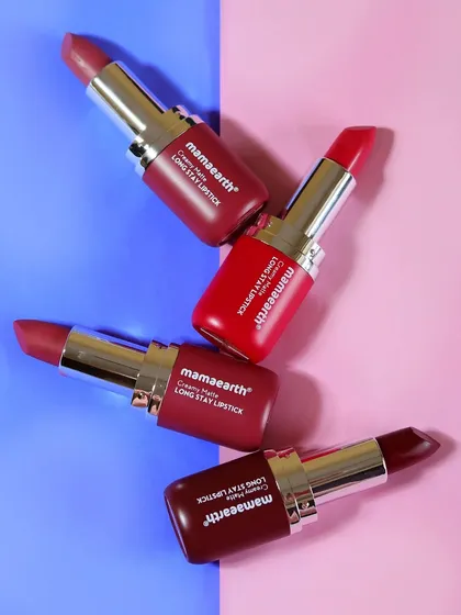 A slightly different angle of the four Mamaearth lipsticks on a pink and blue background, offering another option for a vibrant social media post.