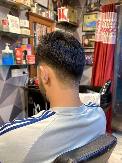 The back view of the taper fade, showing the clean and gradual blend from the neckline up. This is a timeless men's haircut.