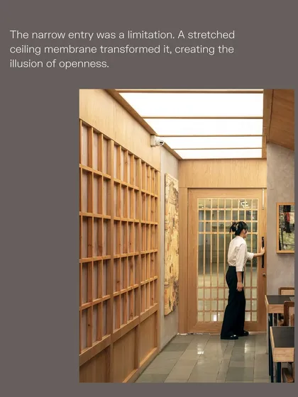 We addressed the limitation of a narrow entryway by installing a stretched ceiling membrane. This technique creates an illusion of openness and height, proving that thoughtful design can turn constraints into compelling features.