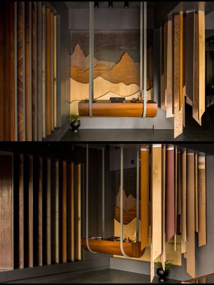 A composite image showing the suspended veneer desk and the various hanging veneer samples. The design allows clients to interact with the materials in a dynamic and artistic way.
