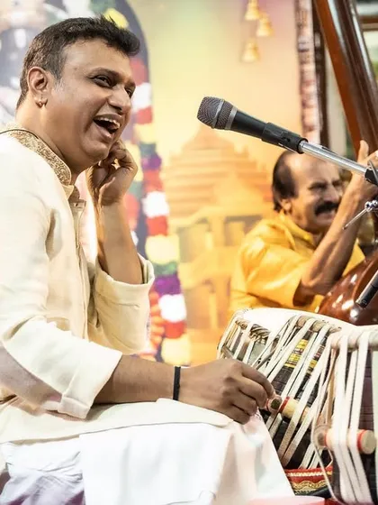 A close-up of Pramath Kiran on tabla during a traditional concert. His expressive playing is a joy to listen to and perform with.