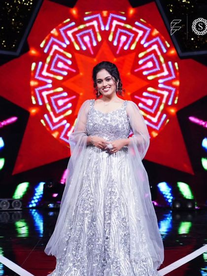 A full-length shot of Sayli Kamble in the sparkling silver gown. This is an ideal outfit for a reception, cocktail party, or any formal event.