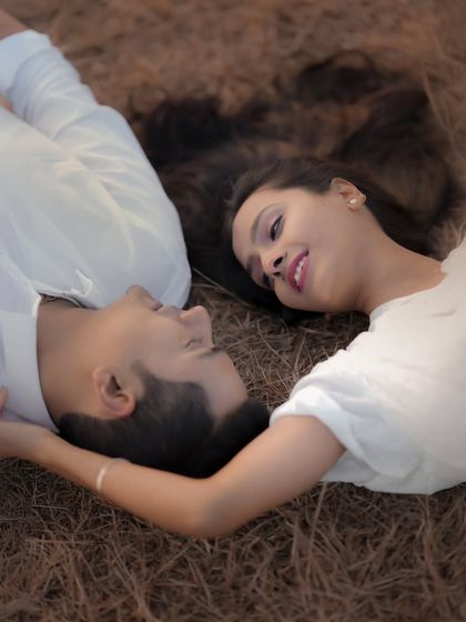 Lying in the grass, lost in each other's eyes. This overhead shot of Atul and Rachita is incredibly intimate and romantic. It’s a simple setup that allows their connection to be the entire story.