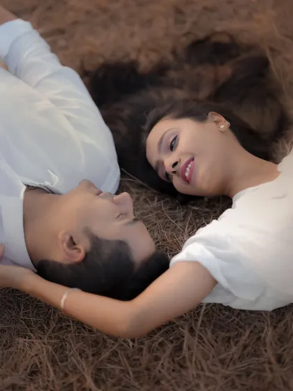 Lying in the grass, lost in each other's eyes. This overhead shot of Atul and Rachita is incredibly intimate and romantic. It’s a simple setup that allows their connection to be the entire story.