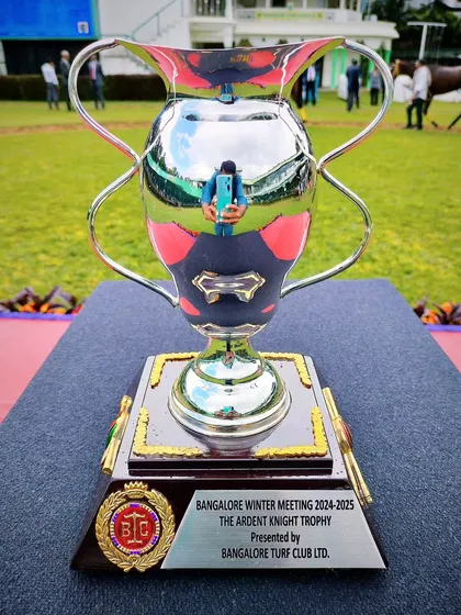 The Ardent Knight Trophy, a classic silver cup with a modern base.