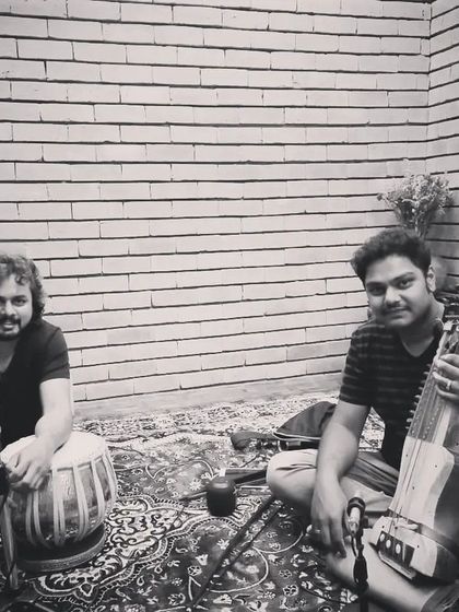 A black and white candid shot with Sarfaraaz Khan.