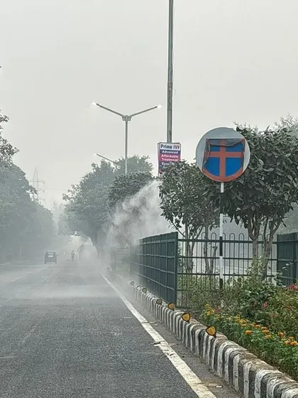 Here you can see my misting system creating a fine fog along a busy road. This mist effectively captures dust raised by traffic and other pollutants, cleaning the air for commuters and residents. This is a practical and effective urban dust suppression solution.