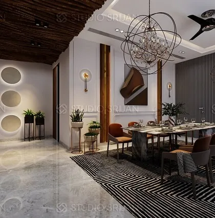 The dining area in the Alameda residence, with a dramatic chandelier and a wall of backlit circular cutouts, creating an artistic and ambient setting for meals.