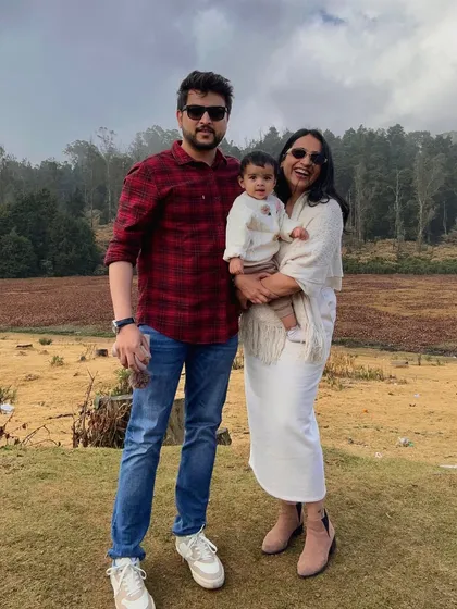 A classic family portrait from our trip to Ooty. This photo captures a happy, relaxed moment against a beautiful natural backdrop, perfect for content that feels both aspirational and achievable for young families.