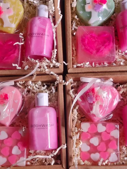 A variety of pink and heart-themed gift boxes, perfect for occasions like Valentine's Day or as a gift for her.