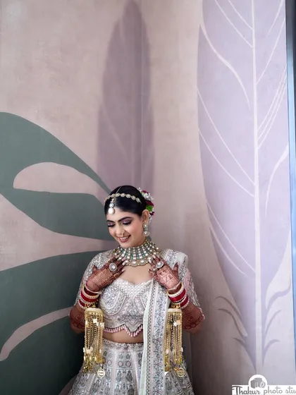 My beautiful bride Disha, ready for her Pheras. She looked like a dream in her white and pink lehenga. The makeup was kept soft and romantic, with pink tones on the eyes and cheeks to create a cohesive, angelic look.
