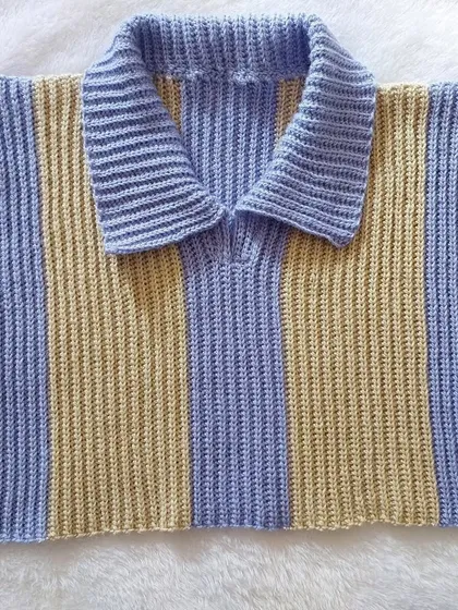 A flat-lay of the Knit-Like Sweater Vest, showcasing the clean lines and the beautiful texture of the stitch.