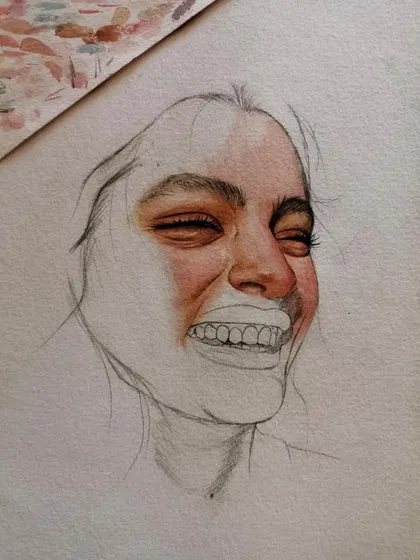 The final version of the mixed-media smiling portrait. The combination of detailed pencil work and splashes of color creates a really dynamic and emotional piece.