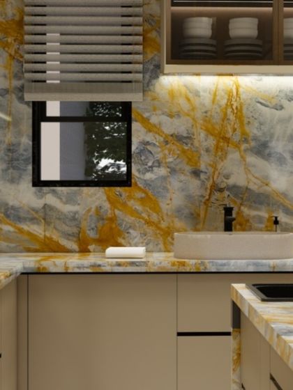 A close-up of the kitchen sink area, showcasing the rich patterns of the golden-hued Italian marble.