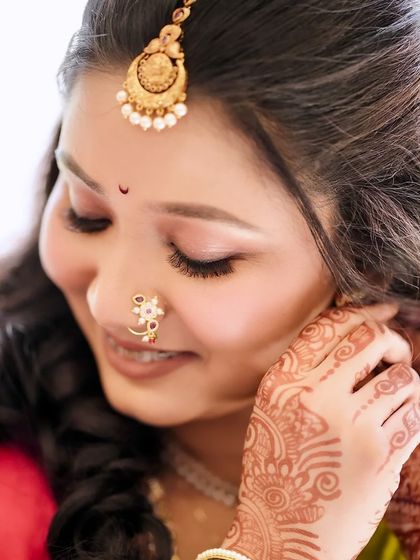 A detailed shot of the eye makeup, showing the soft blend of neutral tones and perfectly defined lashes for her engagement look.