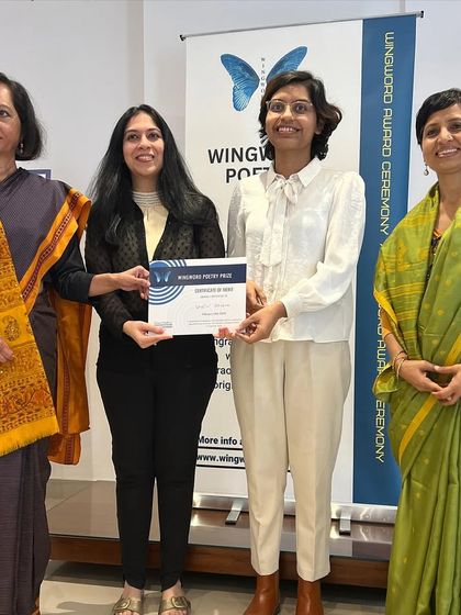 A winner receives her certificate from our esteemed judges and organizers.