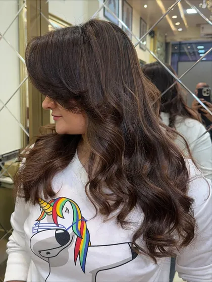 A side view of the hazelnut mocha color, showing how it frames the face. This is a great example of a sophisticated and easy to maintain hair color.