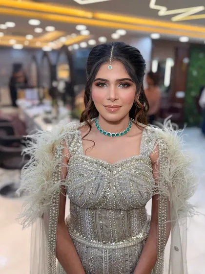 The maang tikka adds a traditional element to this modern soft glam look. The makeup is versatile enough for any style.