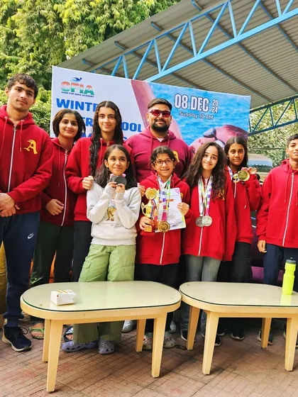 The team celebrating a successful Winter Swim Meet where we won 4 'Best Swimmer' trophies and over 30 medals. Every swimmer achieved a personal best time, ending the year on a high note.