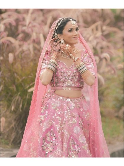 A close-up of our beautiful bride, Rakshita. We guided her on every detail, from the placement of her matha patti to the style of her earrings, ensuring her virtual styling experience was as thorough as an in-person one.