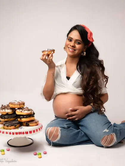 Let's be real, pregnancy comes with cravings. This is a reminder that your session is about you. If you want to celebrate with donuts, wear a sequin dress, or just be cozy, we will make it happen. It's about capturing your real, beautiful, and sometimes funny moments.