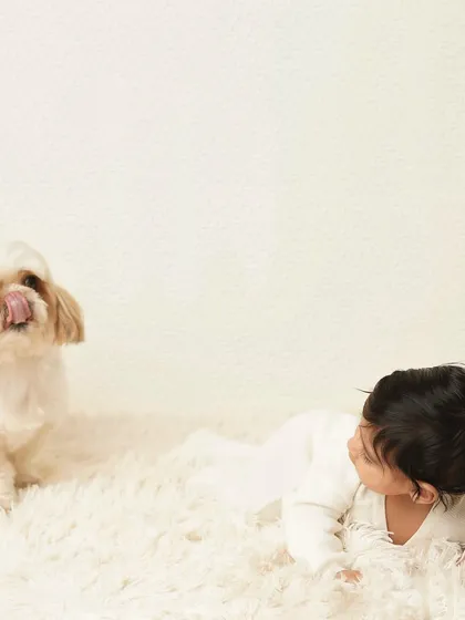 A fun and unexpected moment as the family dog joins the photoshoot. Capturing interactions with pets adds a unique and personal touch to your gallery.
