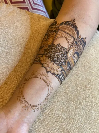 The same Taj Mahal design in progress, showing the intricate outline work before the shading and filling is complete.