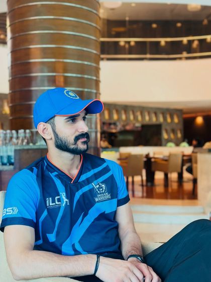 In my official team gear, ready to support the players. My work combines sports science, yoga, and physiotherapy for a holistic approach to athletic care.