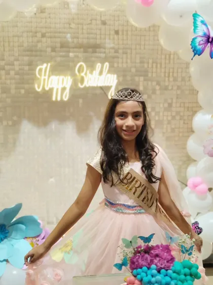 The birthday girl looking lovely in her party dress.