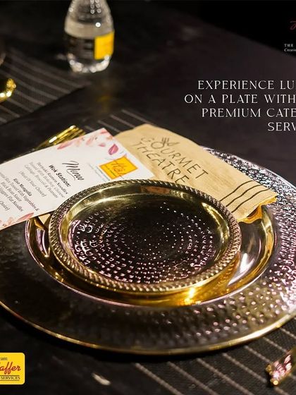 Experience luxury on a plate with our premium catering services. This close-up shows our elegant hammered-metal dinnerware and a custom menu card, promising a gourmet theatre experience for every guest.