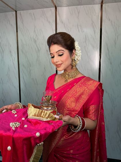 A serene moment of the bride during her Karwa Chauth puja, her jewellery adding to the traditional feel.