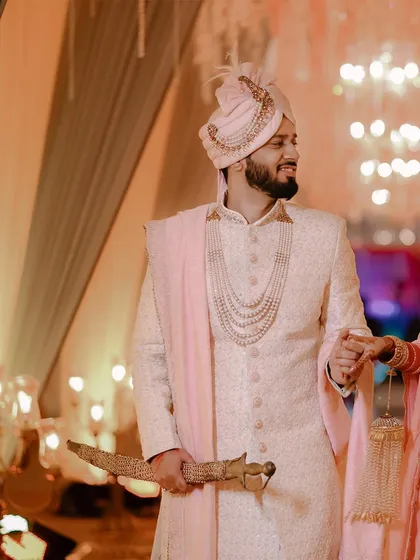 A candid shot of the groom, Prateek, smiling during his wedding ceremony in Jammu.