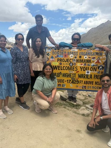 Posing by the iconic Border Roads Organisation sign at Warila Pass. These are the moments that define a Ladakh road trip, and I make sure your group gets to experience them all.