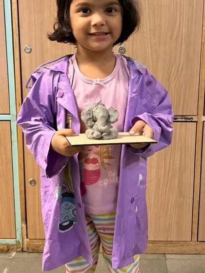 Pure pride and joy. This young artist from our workshop at Indoscots Global School in Thane is thrilled with the Ganpati idol she created with her own hands.